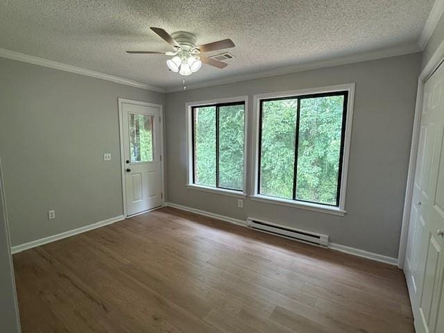 363 Mount Vernon Dr, Calhoun, GA 30701 - unfurnished room with a baseboard heating unit, ornamental molding, a textured ceiling, wood finished floors, and ceiling fan