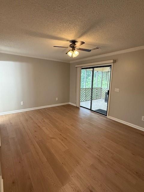 363 Mount Vernon Dr, Calhoun, GA 30701 - unfurnished room featuring crown molding, a textured ceiling, wood finished floors, ceiling fan, and baseboards