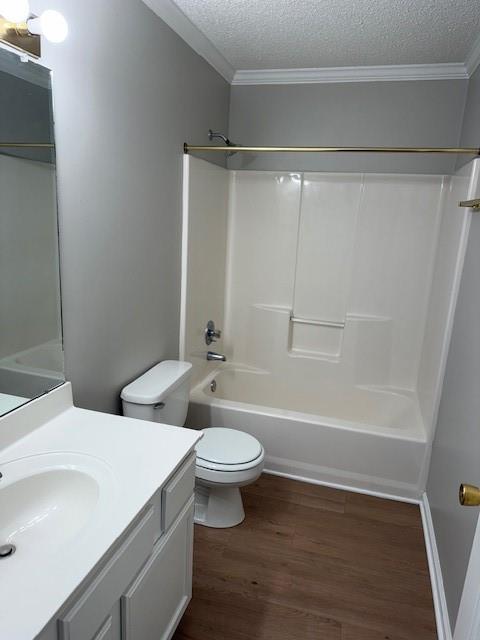 363 Mount Vernon Dr, Calhoun, GA 30701 - full bath featuring wood finished floors, vanity, toilet, tub / shower combination, and a textured ceiling