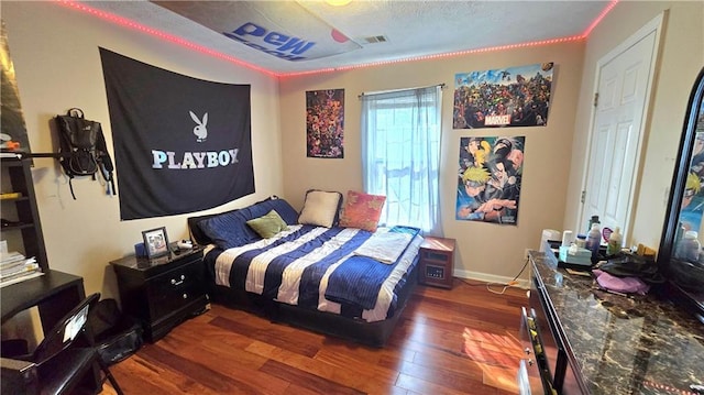 bedroom featuring dark hardwood / wood-style flooring