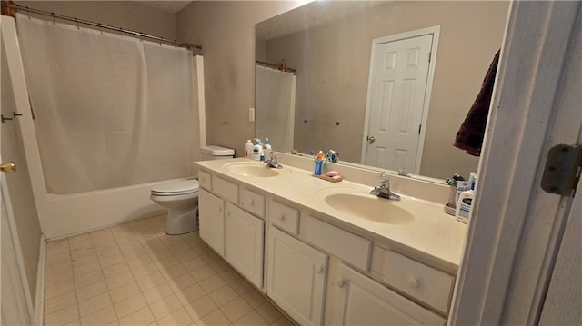 full bathroom featuring vanity, tile patterned floors, toilet, and shower / bath combo with shower curtain