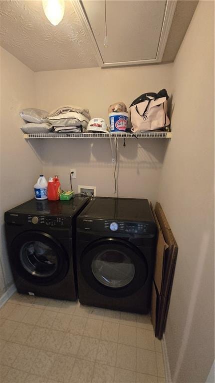 clothes washing area featuring independent washer and dryer