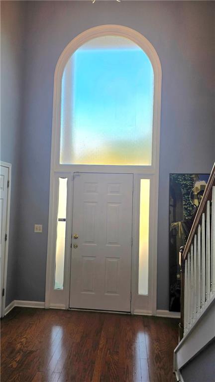 foyer with dark hardwood / wood-style floors