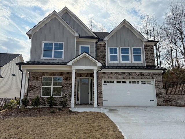 view of front of property with a garage and a front lawn