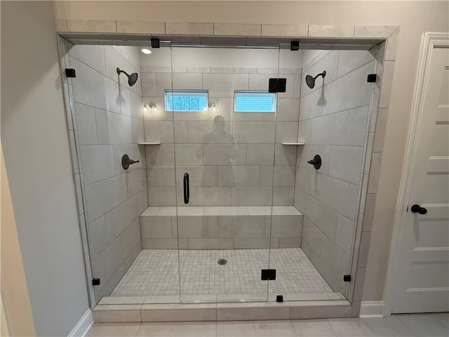 bathroom with a shower with shower door