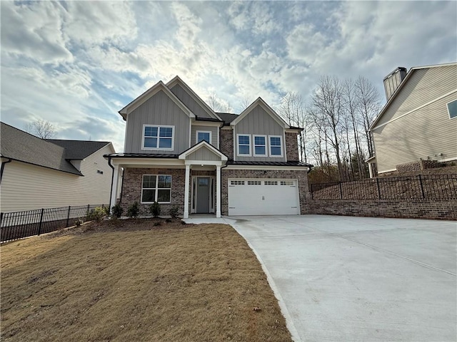 craftsman-style house featuring a garage and a front yard