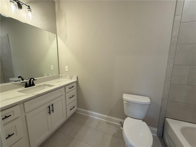 bathroom featuring vanity, toilet, and tile patterned flooring