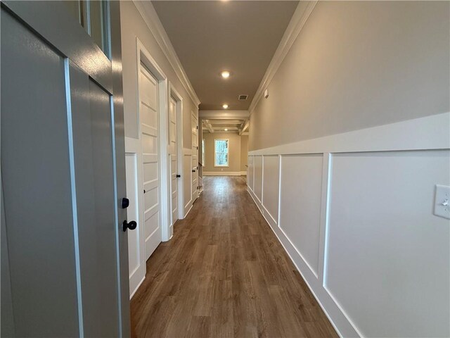 unfurnished living room featuring ceiling fan, a fireplace, a healthy amount of sunlight, and coffered ceiling