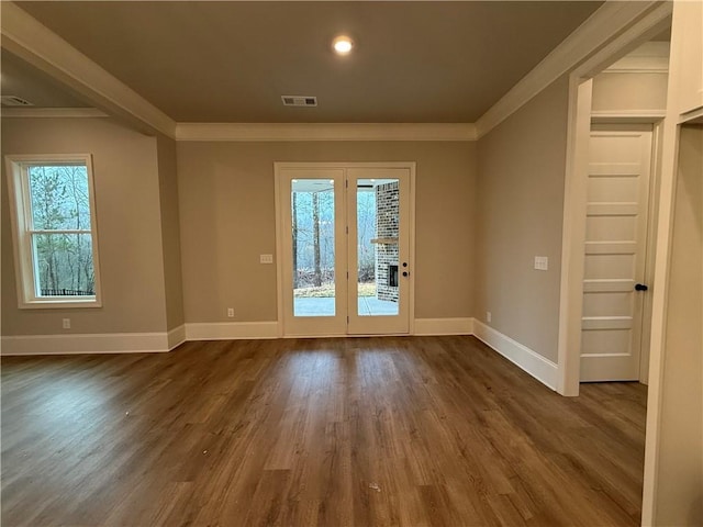 entryway featuring hardwood / wood-style floors and crown molding