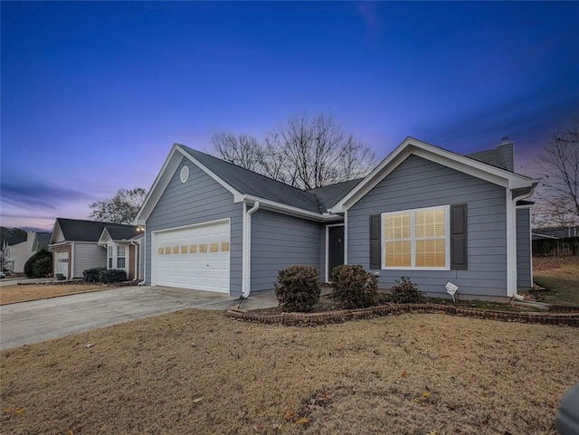 single story home featuring a lawn and a garage