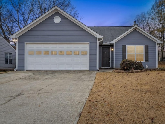 ranch-style house featuring a garage