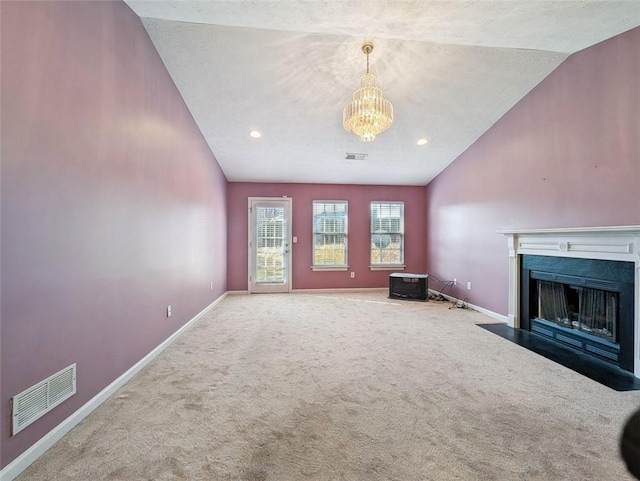 unfurnished living room with carpet flooring, lofted ceiling, and a notable chandelier