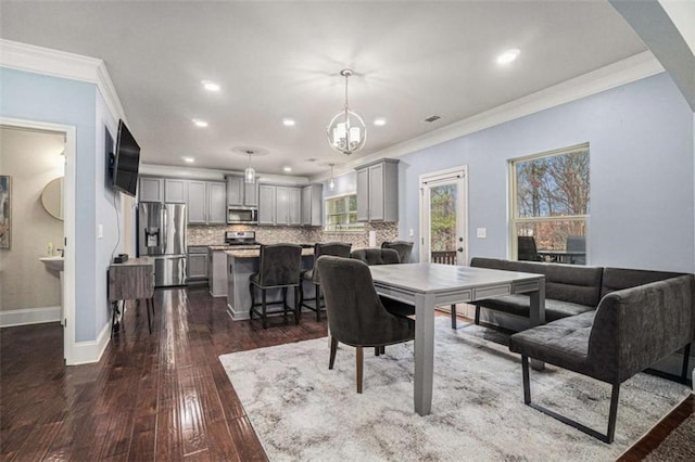 dining room with dark wood-style flooring, recessed lighting, visible vents, ornamental molding, and baseboards