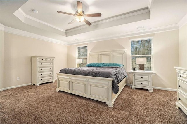 bedroom featuring ornamental molding, a tray ceiling, and carpet flooring