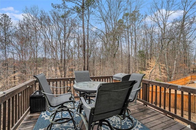 wooden terrace featuring outdoor dining space