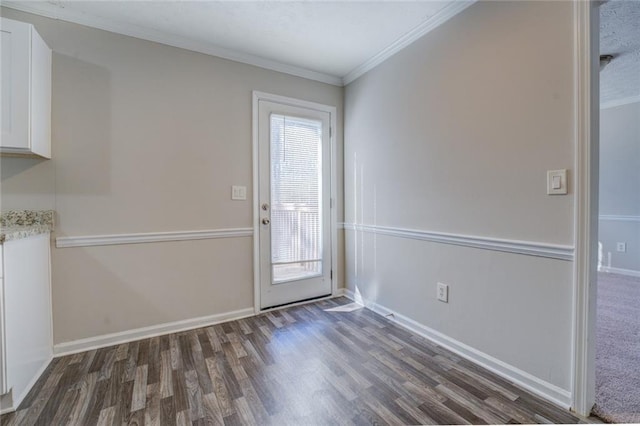 doorway to outside with crown molding and dark hardwood / wood-style floors