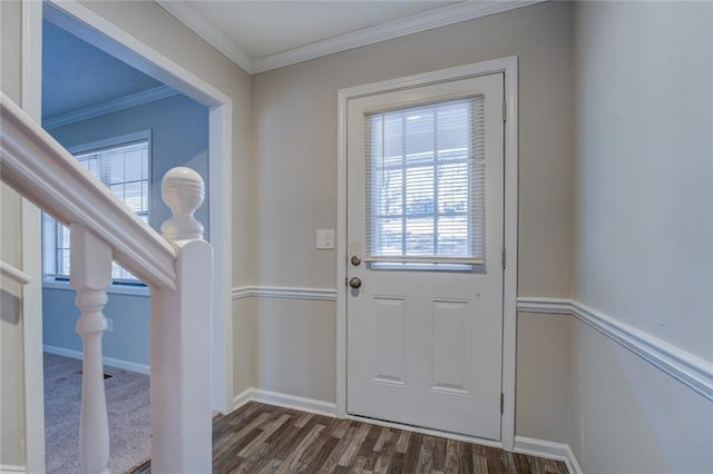 entryway with ornamental molding and dark wood-type flooring