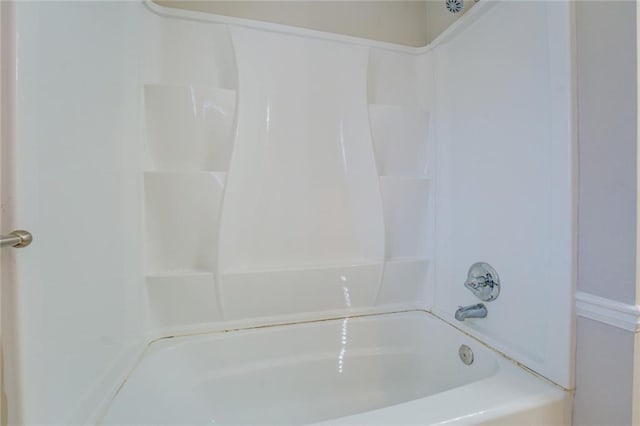 bathroom with shower / washtub combination