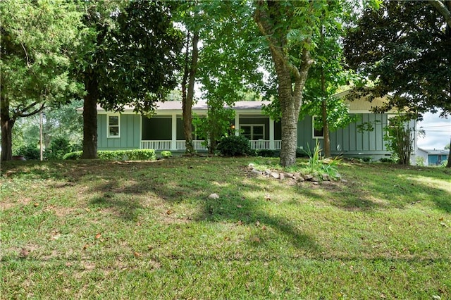 view of yard featuring covered porch