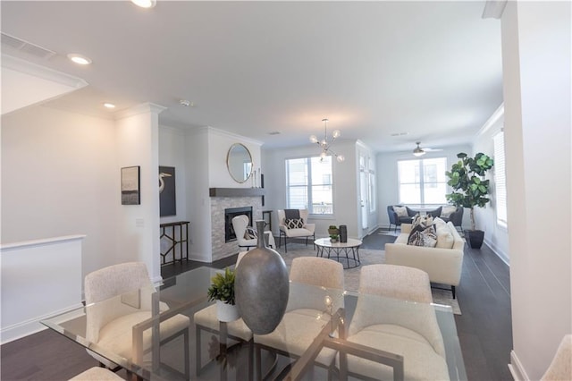 5448 Howington Ct E Unit 194, Buford, GA 30518 - living room featuring baseboards, crown molding, a stone fireplace, dark wood-style flooring, and recessed lighting