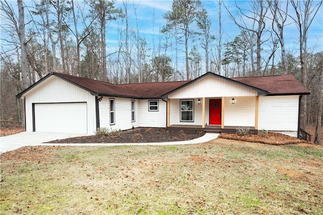 ranch-style home featuring driveway, a front yard, a garage, and roof with shingles