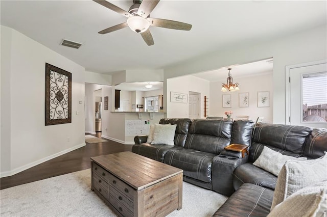5225 Stonehaven Vw, Cumming, GA 30040 - living room with ceiling fan, a chandelier, baseboards, and light wood-style floors