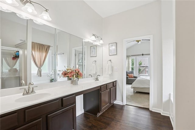 5225 Stonehaven Vw, Cumming, GA 30040 - ensuite bathroom with wood finished floors, double vanity, a shower with door, and baseboards