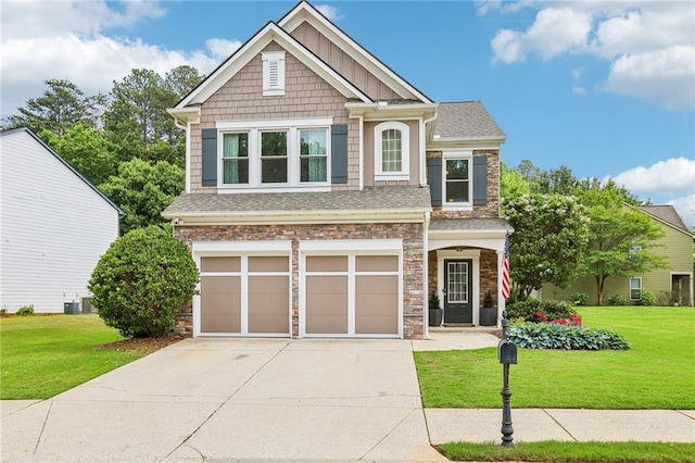 5225 Stonehaven Vw, Cumming, GA 30040 - craftsman-style house featuring stone siding, an attached garage, and a front yard