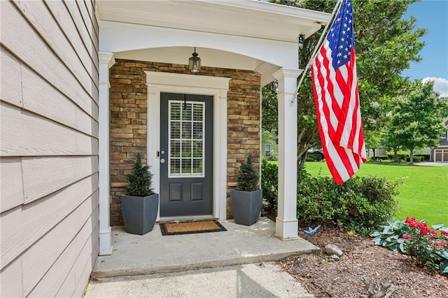5225 Stonehaven Vw, Cumming, GA 30040 - entrance to property with stone siding, a yard, and a porch
