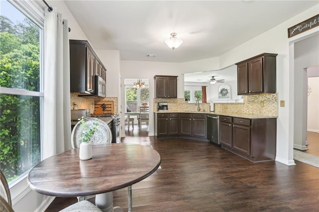 5225 Stonehaven Vw, Cumming, GA 30040 - kitchen featuring appliances with stainless steel finishes, dark brown cabinets, decorative backsplash, and dark wood-style floors