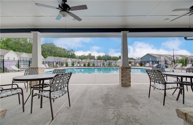 view of pool with ceiling fan and a patio area