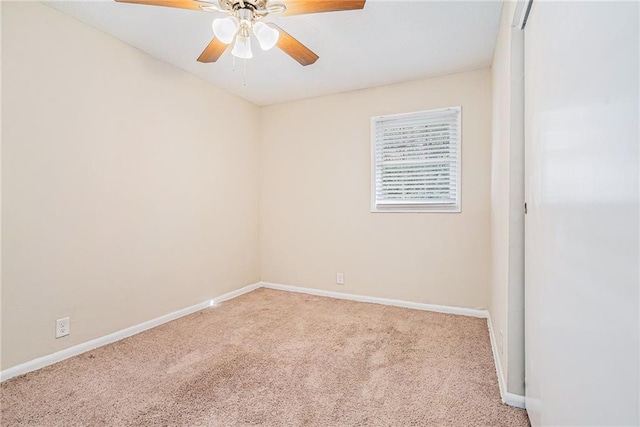 empty room with ceiling fan and light colored carpet