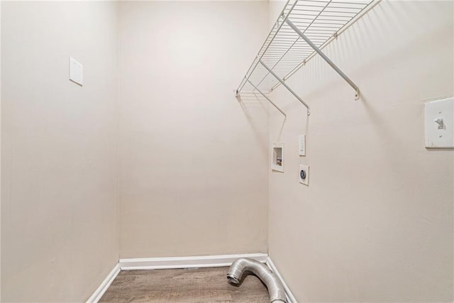 laundry room featuring washer hookup, hardwood / wood-style flooring, and electric dryer hookup