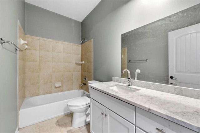 full bathroom with toilet, vanity, tile patterned floors, and tiled shower / bath