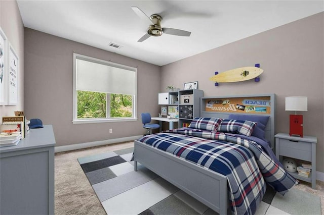 bedroom with ceiling fan and light colored carpet