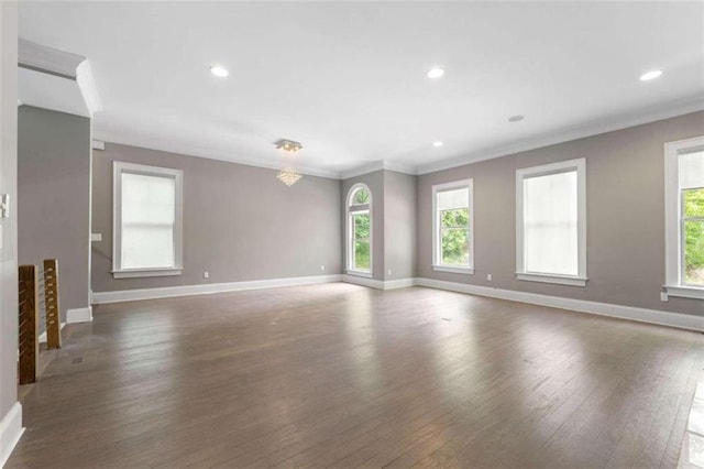 unfurnished room with dark hardwood / wood-style floors and crown molding