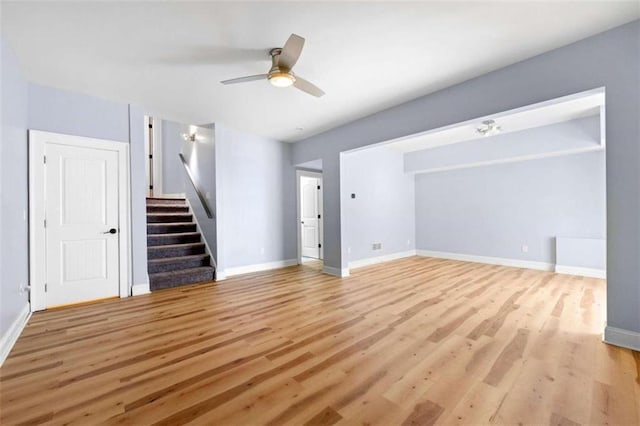 unfurnished living room featuring light hardwood / wood-style flooring and ceiling fan