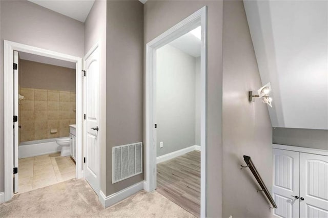 corridor featuring light hardwood / wood-style floors