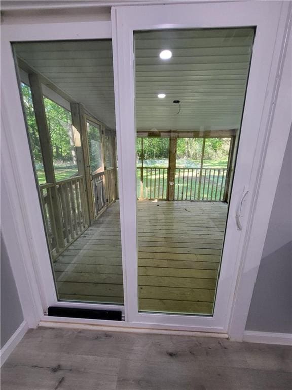 entryway with plenty of natural light, baseboards, and recessed lighting