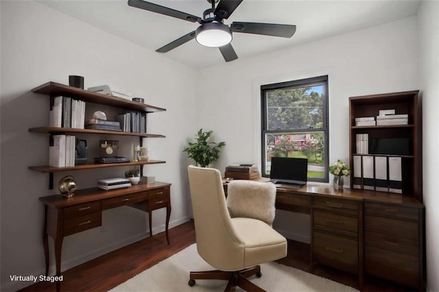 office space featuring ceiling fan and dark hardwood / wood-style flooring