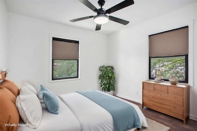 bedroom featuring dark wood-type flooring and ceiling fan