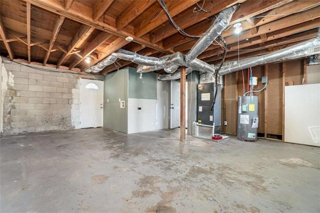 basement with electric water heater and heating unit