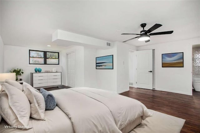 bedroom with ceiling fan and dark hardwood / wood-style floors