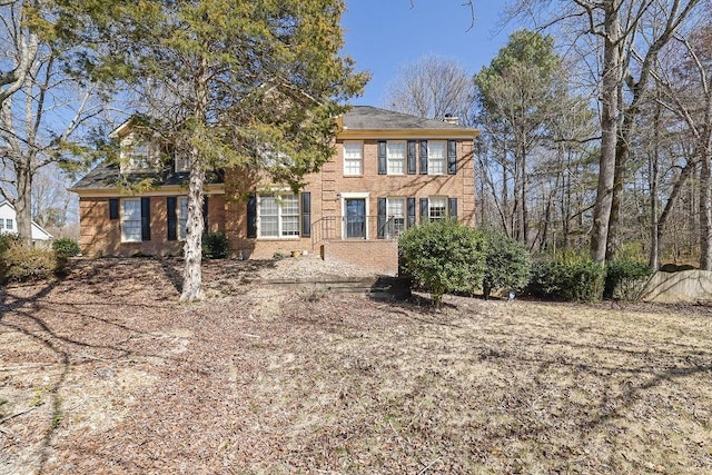 colonial house with brick siding