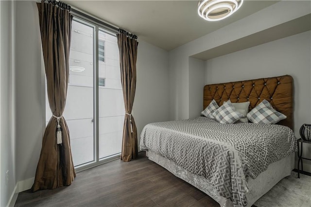 bedroom with wood-type flooring