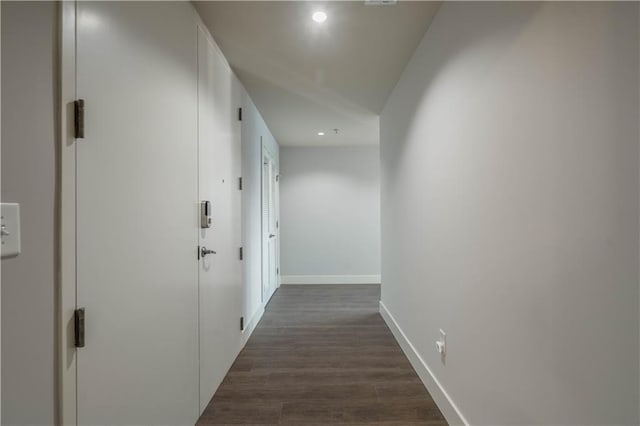 corridor with dark wood-type flooring