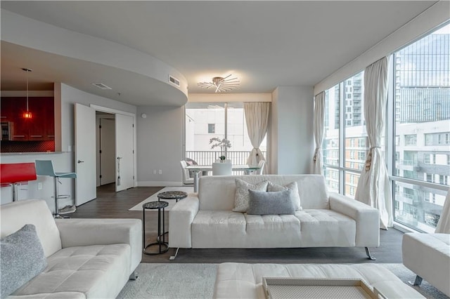 living room with hardwood / wood-style flooring and expansive windows