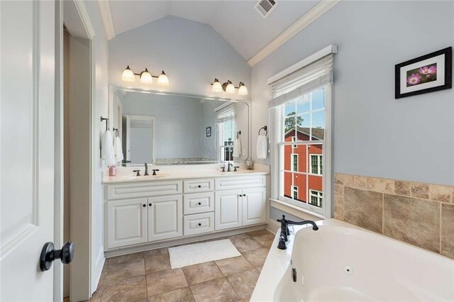 735 Neel Reid Dr, Roswell, GA 30075 - full bathroom with double vanity, visible vents, vaulted ceiling, and a sink