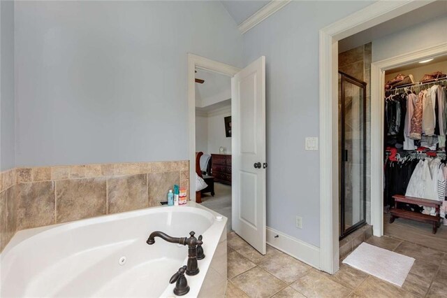 735 Neel Reid Dr, Roswell, GA 30075 - bathroom featuring a shower stall, connected bathroom, crown molding, a walk in closet, and a jetted tub