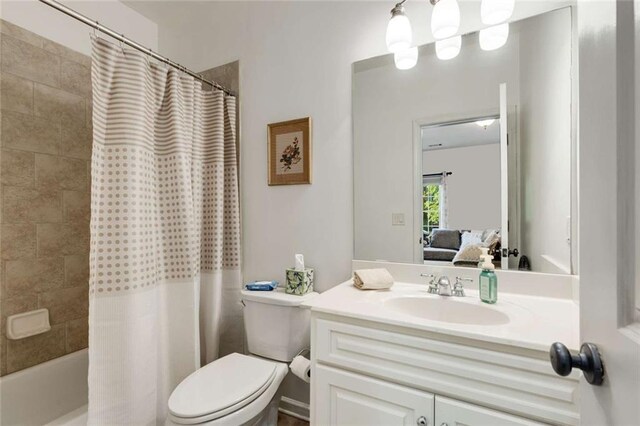 735 Neel Reid Dr, Roswell, GA 30075 - full bathroom featuring toilet, shower / bath combination with curtain, vanity, and ensuite bath